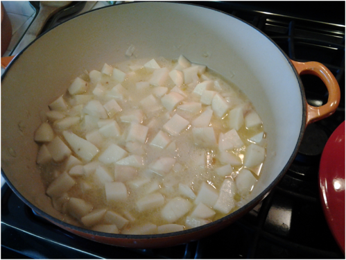 Adding the potatoes to the pot